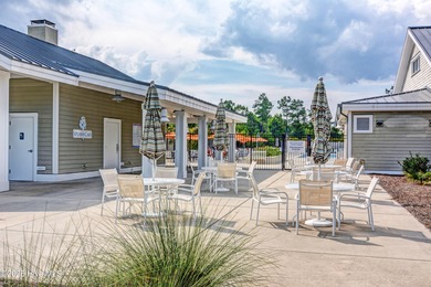 Exquisite home with a view of the pond located in the on Cape Fear National At Brunswick Forest in North Carolina - for sale on GolfHomes.com, golf home, golf lot