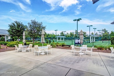 Exquisite home with a view of the pond located in the on Cape Fear National At Brunswick Forest in North Carolina - for sale on GolfHomes.com, golf home, golf lot