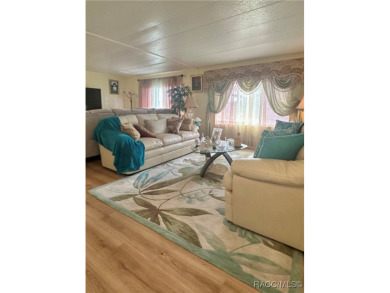 Welcome to this beautifully maintained 2-bedroom, 2-bathroom on Heather Golf and Country Club in Florida - for sale on GolfHomes.com, golf home, golf lot