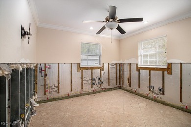 This investor special offers a unique opportunity for those on Twin Isles Country Club in Florida - for sale on GolfHomes.com, golf home, golf lot