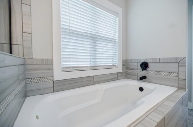 Located on one of the best streets in East Lake, this like-new on East Lake Golf Club in Georgia - for sale on GolfHomes.com, golf home, golf lot