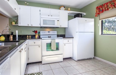 Welcome to Bird Bay Village, a fabulous resort-style condominium on Bird Bay Executive Golf Club in Florida - for sale on GolfHomes.com, golf home, golf lot