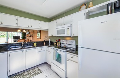 Welcome to Bird Bay Village, a fabulous resort-style condominium on Bird Bay Executive Golf Club in Florida - for sale on GolfHomes.com, golf home, golf lot