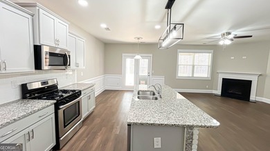 Welcome to this beautifully updated 5-bedroom, 3-bath on Canongate At Heron Bay in Georgia - for sale on GolfHomes.com, golf home, golf lot