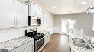 Welcome to this beautifully updated 5-bedroom, 3-bath on Canongate At Heron Bay in Georgia - for sale on GolfHomes.com, golf home, golf lot