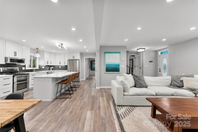 Welcome home to this beautifully updated gem in the heart of the on Raintree Country Club in North Carolina - for sale on GolfHomes.com, golf home, golf lot