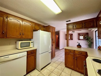 Charming 2-Bed, 2-Bath Brick Ranch style home in 55+ Enchanted on Howling Trails Golf  in Texas - for sale on GolfHomes.com, golf home, golf lot