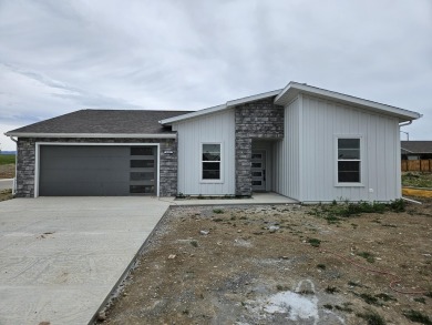 Brand new construction, fully landscaped. Located in Hidden on Hidden Bridge Golf Club in Wyoming - for sale on GolfHomes.com, golf home, golf lot