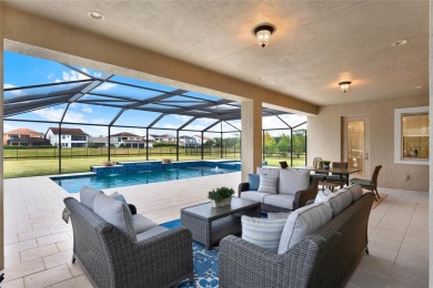 Nestled in the Eagle Creek golf community, this exquisite on Eagle Creek Golf Club in Florida - for sale on GolfHomes.com, golf home, golf lot