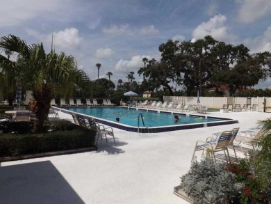 Furnished 1 bedroom-1.5 bath condo. 18* diagonal tile throughout on The American Golf Club in Florida - for sale on GolfHomes.com, golf home, golf lot