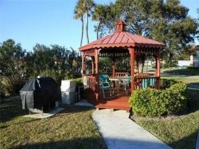 Furnished 1 bedroom-1.5 bath condo. 18* diagonal tile throughout on The American Golf Club in Florida - for sale on GolfHomes.com, golf home, golf lot