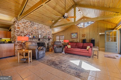 Discover this beautifully preserved mid-century lake house on Francis Lake Golf Club in Georgia - for sale on GolfHomes.com, golf home, golf lot