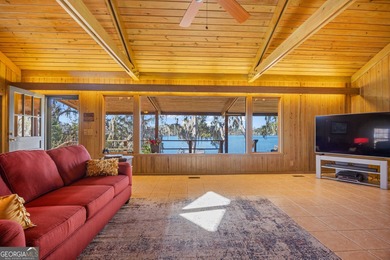 Discover this beautifully preserved mid-century lake house on Francis Lake Golf Club in Georgia - for sale on GolfHomes.com, golf home, golf lot