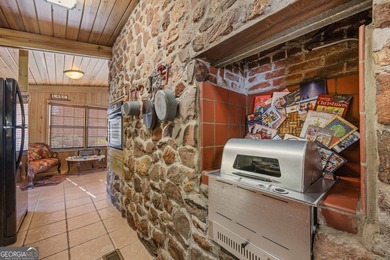 Discover this beautifully preserved mid-century lake house on Francis Lake Golf Club in Georgia - for sale on GolfHomes.com, golf home, golf lot