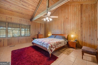 Discover this beautifully preserved mid-century lake house on Francis Lake Golf Club in Georgia - for sale on GolfHomes.com, golf home, golf lot