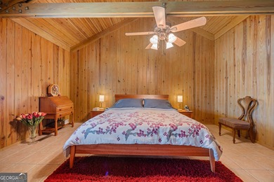 Discover this beautifully preserved mid-century lake house on Francis Lake Golf Club in Georgia - for sale on GolfHomes.com, golf home, golf lot