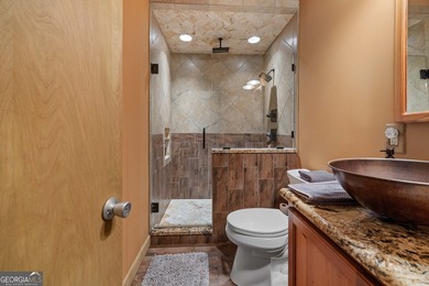 Discover this beautifully preserved mid-century lake house on Francis Lake Golf Club in Georgia - for sale on GolfHomes.com, golf home, golf lot