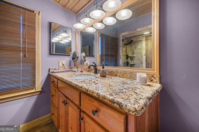 Discover this beautifully preserved mid-century lake house on Francis Lake Golf Club in Georgia - for sale on GolfHomes.com, golf home, golf lot