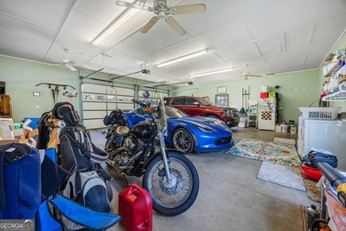 Discover this beautifully preserved mid-century lake house on Francis Lake Golf Club in Georgia - for sale on GolfHomes.com, golf home, golf lot