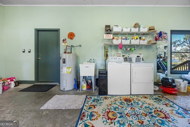 Discover this beautifully preserved mid-century lake house on Francis Lake Golf Club in Georgia - for sale on GolfHomes.com, golf home, golf lot