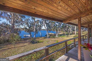 Discover this beautifully preserved mid-century lake house on Francis Lake Golf Club in Georgia - for sale on GolfHomes.com, golf home, golf lot