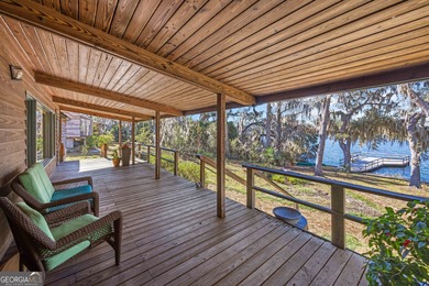 Discover this beautifully preserved mid-century lake house on Francis Lake Golf Club in Georgia - for sale on GolfHomes.com, golf home, golf lot