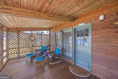 Discover this beautifully preserved mid-century lake house on Francis Lake Golf Club in Georgia - for sale on GolfHomes.com, golf home, golf lot