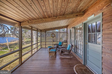 Discover this beautifully preserved mid-century lake house on Francis Lake Golf Club in Georgia - for sale on GolfHomes.com, golf home, golf lot