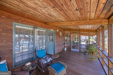 Discover this beautifully preserved mid-century lake house on Francis Lake Golf Club in Georgia - for sale on GolfHomes.com, golf home, golf lot