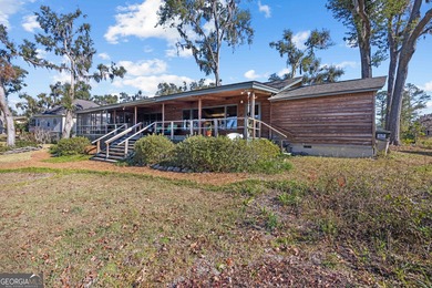 Discover this beautifully preserved mid-century lake house on Francis Lake Golf Club in Georgia - for sale on GolfHomes.com, golf home, golf lot