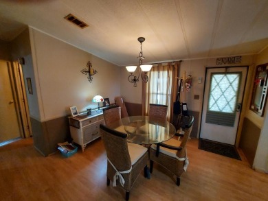 This home has great 'bones' with lots of potential for the right on Lakes at Leesburg Golf Course in Florida - for sale on GolfHomes.com, golf home, golf lot