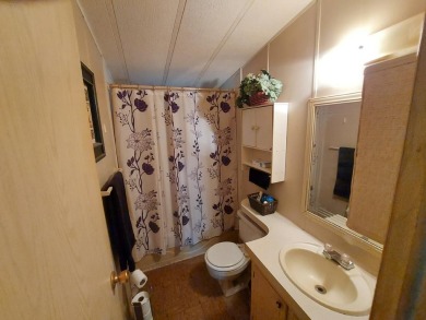 This home has great 'bones' with lots of potential for the right on Lakes at Leesburg Golf Course in Florida - for sale on GolfHomes.com, golf home, golf lot
