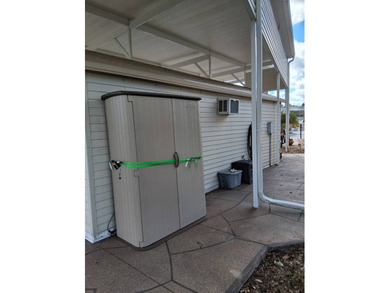 LARGE RV LOT WITH OVERSIZED PORT, BEDROOM, BATH, PATIO AREA AND on Deer Creek RV Golf Resort in Florida - for sale on GolfHomes.com, golf home, golf lot