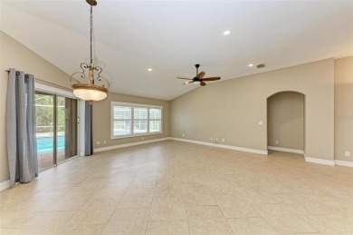 **BEAUTIFUL POOL HOME ,WITH HOT TUB, OVERLOOKING PRESERVE AND on Caloosa Greens Executive Golf Course in Florida - for sale on GolfHomes.com, golf home, golf lot