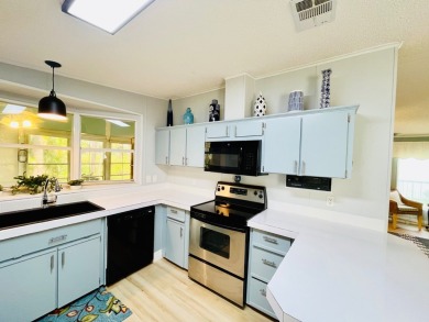 Spacious 2 bed, 2 bath home with open floor plan.Large master on Pine Lakes Country Club in Florida - for sale on GolfHomes.com, golf home, golf lot