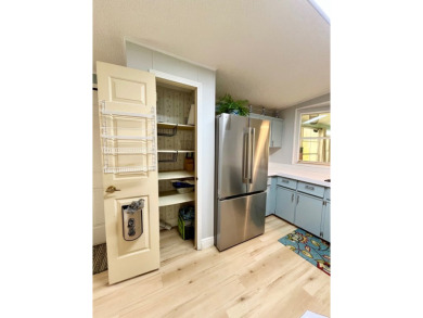 Spacious 2 bed, 2 bath home with open floor plan.Large master on Pine Lakes Country Club in Florida - for sale on GolfHomes.com, golf home, golf lot