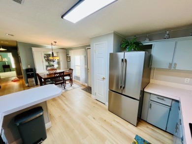 Spacious 2 bed, 2 bath home with open floor plan.Large master on Pine Lakes Country Club in Florida - for sale on GolfHomes.com, golf home, golf lot