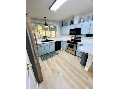 Spacious 2 bed, 2 bath home with open floor plan.Large master on Pine Lakes Country Club in Florida - for sale on GolfHomes.com, golf home, golf lot
