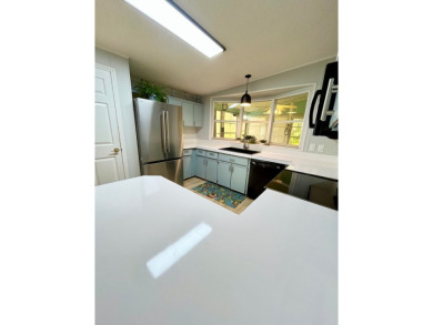 Spacious 2 bed, 2 bath home with open floor plan.Large master on Pine Lakes Country Club in Florida - for sale on GolfHomes.com, golf home, golf lot