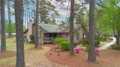 Nestled on the picturesque 10th fairway, this beautiful townhome on Gates Four Golf and Country Club in North Carolina - for sale on GolfHomes.com, golf home, golf lot