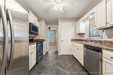 Nestled on the picturesque 10th fairway, this beautiful townhome on Gates Four Golf and Country Club in North Carolina - for sale on GolfHomes.com, golf home, golf lot
