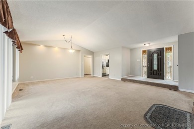 Nestled on the picturesque 10th fairway, this beautiful townhome on Gates Four Golf and Country Club in North Carolina - for sale on GolfHomes.com, golf home, golf lot