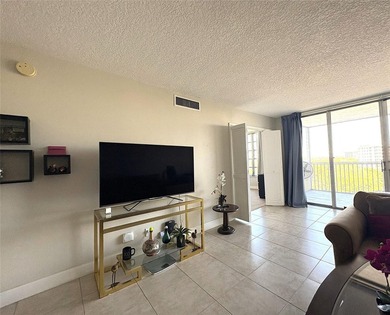 Escape to this spacious 2BR/2BA condo situated in a private on Palm-Aire Country Club and Resort - Palms in Florida - for sale on GolfHomes.com, golf home, golf lot