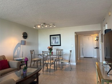 Escape to this spacious 2BR/2BA condo situated in a private on Palm-Aire Country Club and Resort - Palms in Florida - for sale on GolfHomes.com, golf home, golf lot