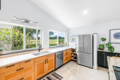 Beautiful golf course views surround this bright and inviting on Indian Spring Golf and Country Club in Florida - for sale on GolfHomes.com, golf home, golf lot