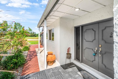 Beautiful golf course views surround this bright and inviting on Indian Spring Golf and Country Club in Florida - for sale on GolfHomes.com, golf home, golf lot