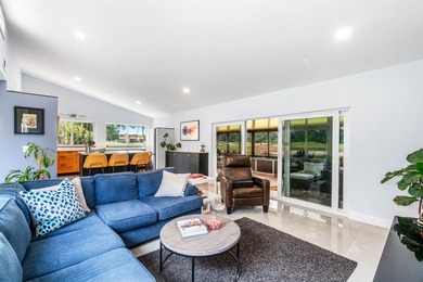 Beautiful golf course views surround this bright and inviting on Indian Spring Golf and Country Club in Florida - for sale on GolfHomes.com, golf home, golf lot