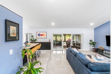 Beautiful golf course views surround this bright and inviting on Indian Spring Golf and Country Club in Florida - for sale on GolfHomes.com, golf home, golf lot