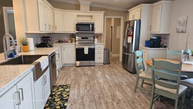 Looking for a Palm Harbor Wellington Model located in the on The Riverside Golf Club in Florida - for sale on GolfHomes.com, golf home, golf lot