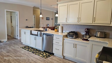 Looking for a Palm Harbor Wellington Model located in the on The Riverside Golf Club in Florida - for sale on GolfHomes.com, golf home, golf lot